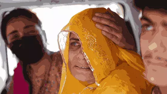 Pakistani citizen Sarita Kanwer consoles her mother, Priya Kanwer, who is an Indian citizen