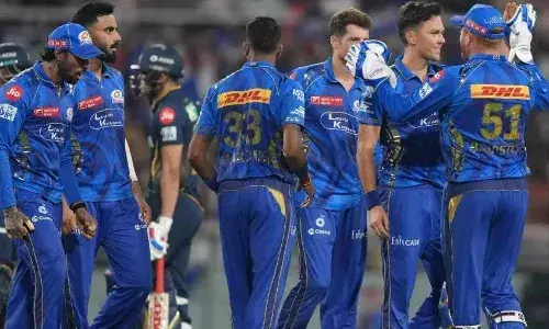 MI players celebrate a GT wicket