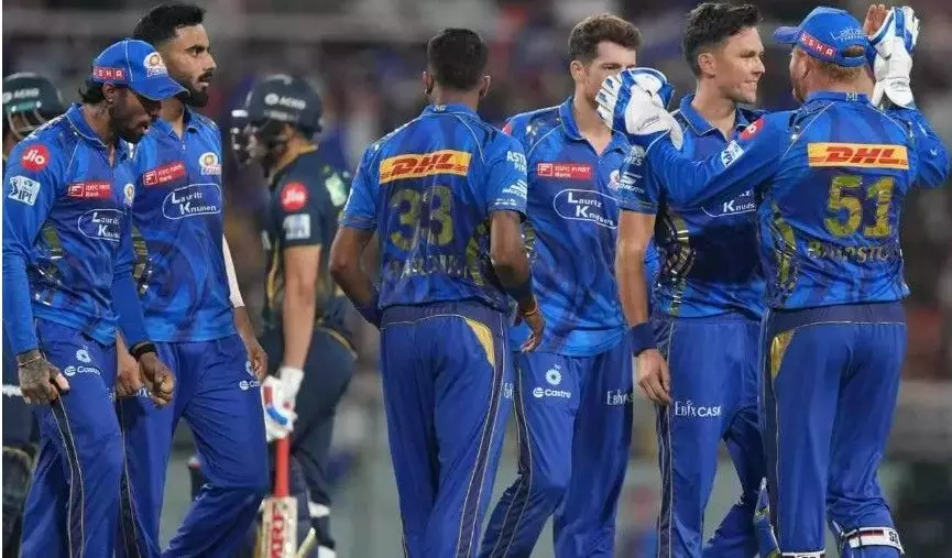 MI players celebrate a GT wicket MI players celebrate a GT wicket